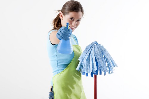 Professional upholstery cleaning on a fabric sofa in a bright living room