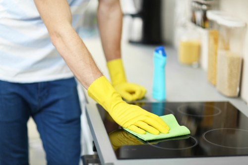 Cleaner vacuuming a living room during end of tenancy cleaning