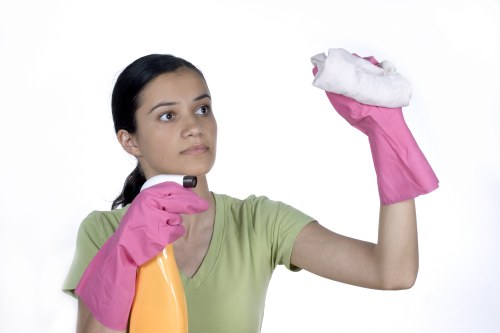 Technician performing deep upholstery cleaning on a sectional couch