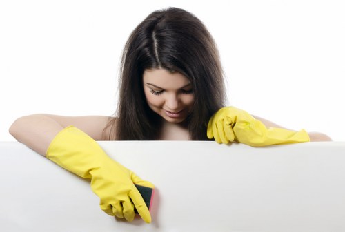 Office cleaning staff sanitizing a break room and kitchen area