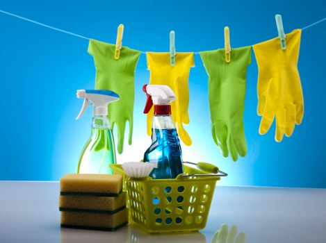 DIY mattress cleaning routine with cleaning supplies on bed